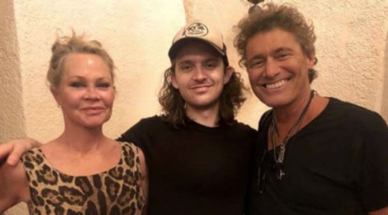 Alexander Bauer with parents, Melanie Griffith and Steven Bauer.